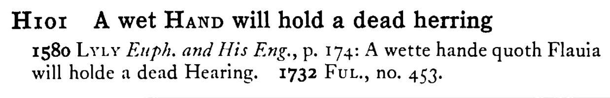 A wet HAND will hold a dead herring - a scanned entry from Tilley's 1950 Dictionary of Proverbs.