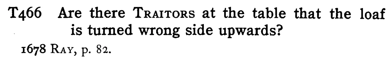 Are there TRAITORS at the table that the loaf is turned wrong side upwards? - a scanned entry from Tilley's 1950 Dictionary of Proverbs.